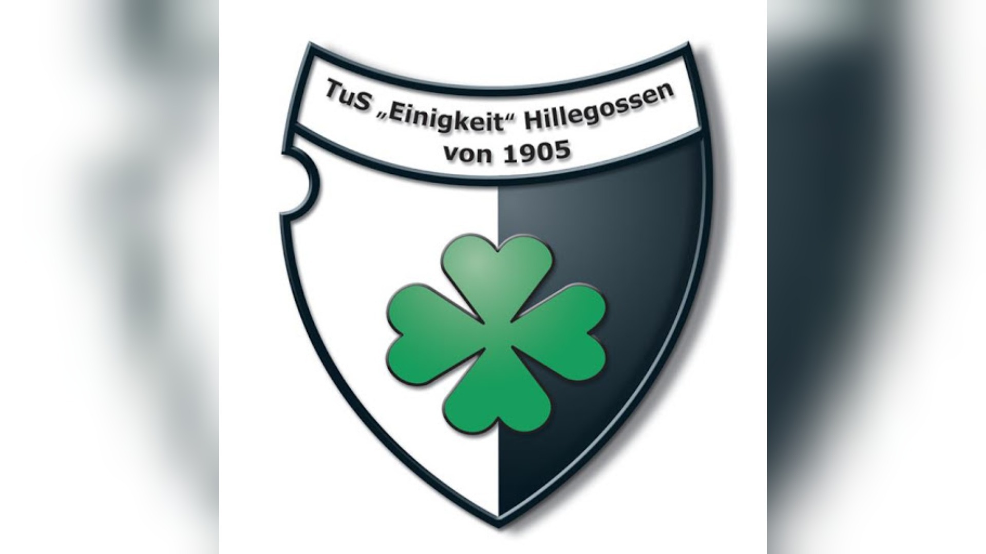 Wappen von TuS „Einigkeit“ Hillegossen von 1905, ein Schild geteilt in Weiß und Dunkel mit grünem Kleeblatt