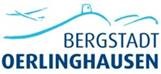 Logo der Bergstadt Oerlinghausen mit blauen Hügeln, einem Haus auf einer Bergkuppe und einem Segelflieger