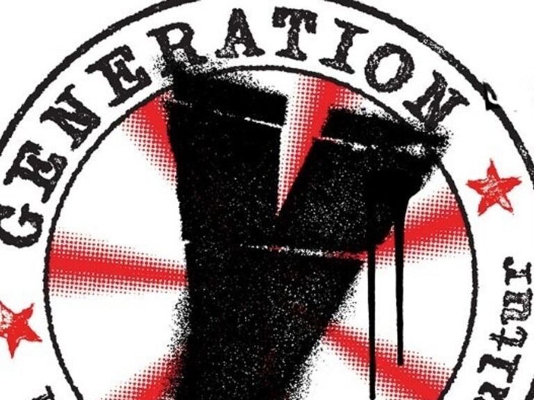 Rundes Logo mit einem tropfenden schwarzen Y, rotem Strahlenmuster und der Aufschrift Generation Update einer Subkultur